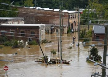 People moved to Asheville to escape extreme weather. They forgot its tragic history.